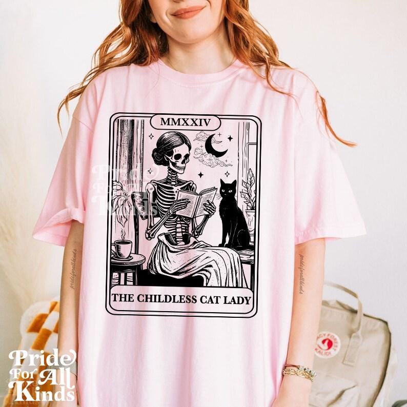 The childless cat lady tarot | kamala harris tarot | feminist halloween | childless cat lady for kamala | read banned books | cat skeleton