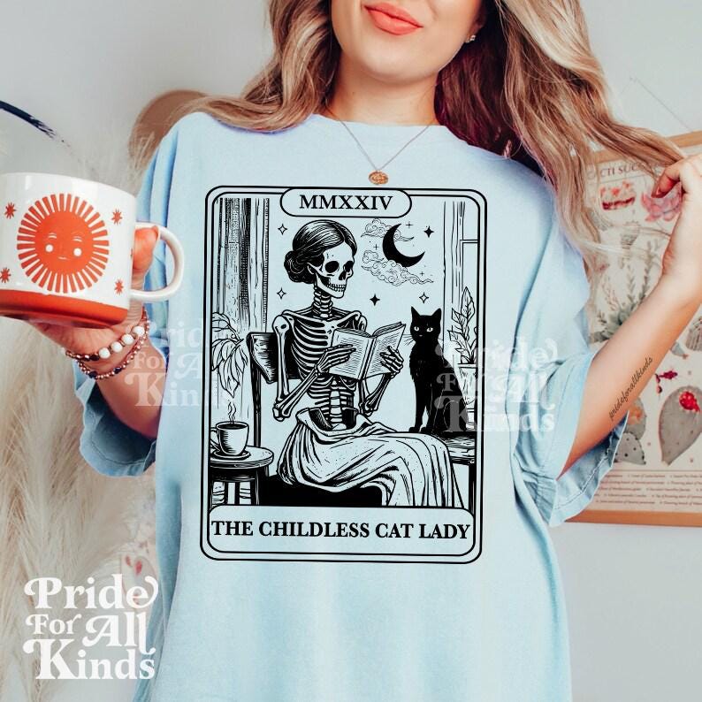 The childless cat lady tarot | kamala harris tarot | feminist halloween | childless cat lady for kamala | read banned books | cat skeleton
