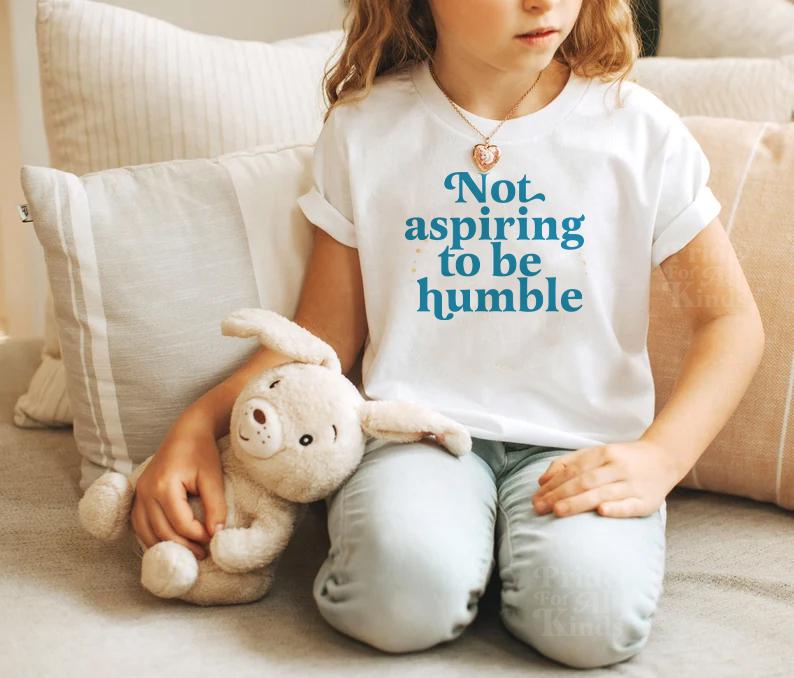 Not aspiring to be humble kids shirt | feminist kids | kamala harris kids shirt | kamala merch | kamala humble quote | kamala podcast | walz