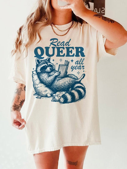 Read queer all year | read queer books | lgbt books | pride merch | cool queer shirt | queer owned shops | nonbinary shirt | trans youth